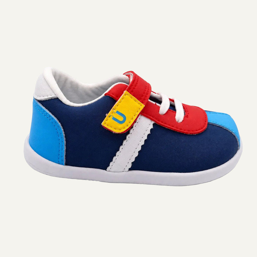 Zapato Barefoot BLUMB VYBE para niño en color zafiro, vista lateral